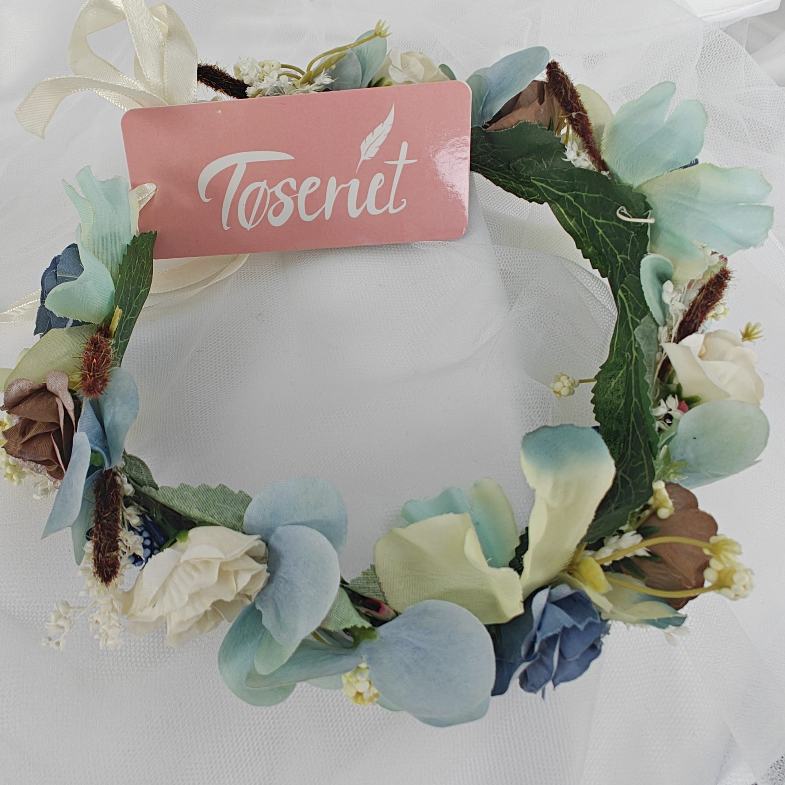 Blomsterkrans med små blå blomster Blomsterkrans med små blå blomster